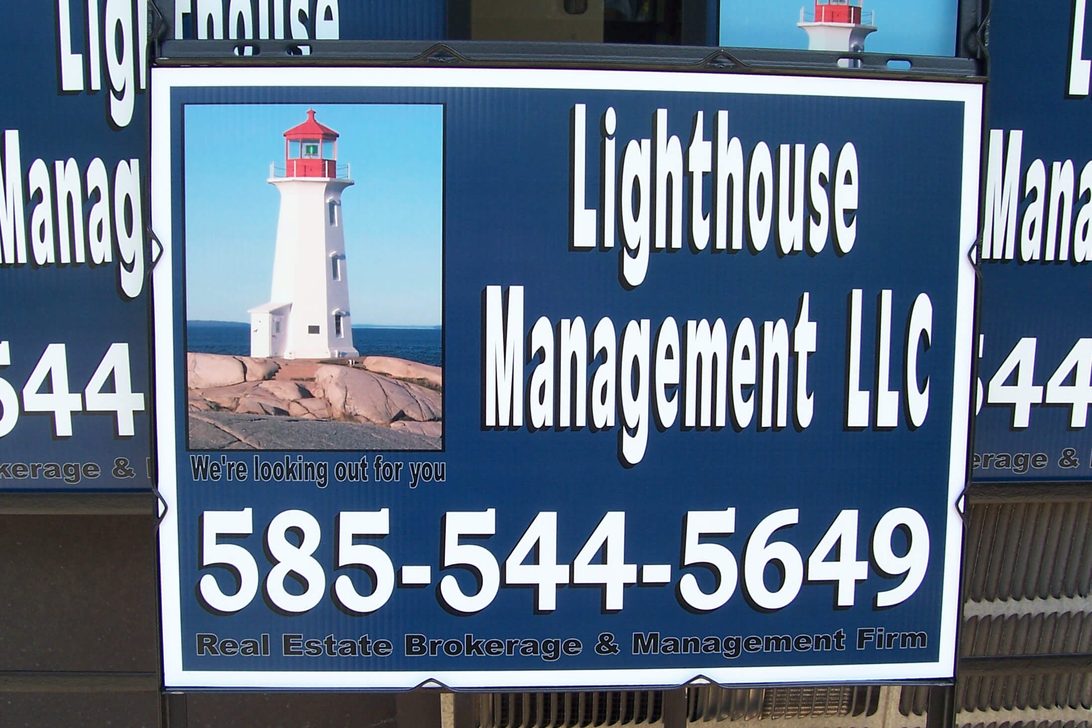 Lighthouse Management LLC real estate lawn sign