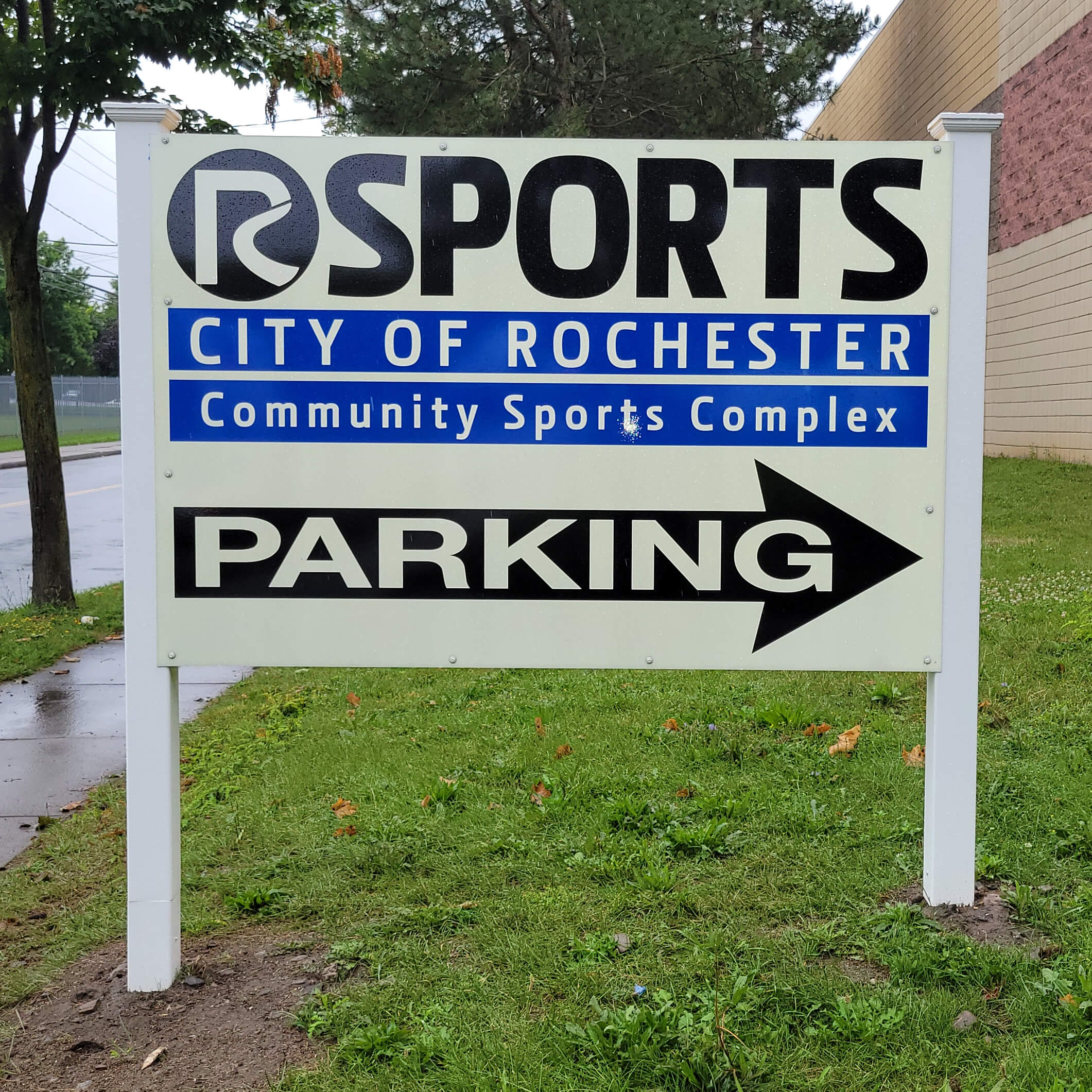 Rochester Community Sports Complex wooden posted outdoor lawn sign